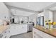 Modern kitchen with stainless steel appliances and white cabinetry at 12735 Aquamarine Ave, Bradenton, FL 34211