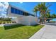 Siesta Beach pavilion, modern architecture, with signage and palm trees at 1430 Harbor Dr, Sarasota, FL 34239