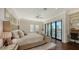 Spacious bedroom with water views, built-in desk, and balcony access at 1430 Harbor Dr, Sarasota, FL 34239