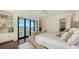 Bright bedroom with water views, balcony access, and built-in shelving at 1430 Harbor Dr, Sarasota, FL 34239