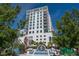 Modern high rise building with white exterior and lush landscaping at 1430 Harbor Dr, Sarasota, FL 34239