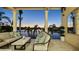 Covered patio with comfortable seating and stunning sunset views at 1430 Harbor Dr, Sarasota, FL 34239