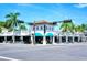 Shopping center with various stores and palm trees at 1430 Harbor Dr, Sarasota, FL 34239