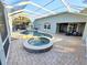 Large screened pool and spa with patio and backyard access at 19025 Fern Meadow Loop, Lutz, FL 33558