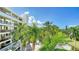 Aerial view of condo building and lush landscaping at 1932 Harbourside Dr # 232, Longboat Key, FL 34228