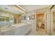 Double vanity bathroom with a separate shower and toilet at 1932 Harbourside Dr # 232, Longboat Key, FL 34228