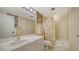 Bathroom with shower/tub combo, toilet and vanity at 1932 Harbourside Dr # 232, Longboat Key, FL 34228