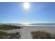 Stunning beach view with calm ocean and sandy shore at 1932 Harbourside Dr # 232, Longboat Key, FL 34228