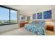 Main bedroom with water view and a tropical comforter at 1932 Harbourside Dr # 232, Longboat Key, FL 34228