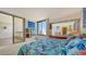 Bedroom with balcony access and tropical bedding at 1932 Harbourside Dr # 232, Longboat Key, FL 34228