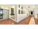 Building hallway with tiled floors and access to unit at 1932 Harbourside Dr # 232, Longboat Key, FL 34228