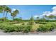 Landscaped garden with circular design and stone accents at 1932 Harbourside Dr # 232, Longboat Key, FL 34228