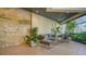 Elegant lobby with comfortable seating and tropical plants at 1932 Harbourside Dr # 232, Longboat Key, FL 34228