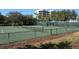 Well-maintained tennis courts with surrounding fencing at 1932 Harbourside Dr # 232, Longboat Key, FL 34228