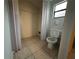 Simple bathroom with toilet and closet at 461 S Florida Ave, Tarpon Springs, FL 34689