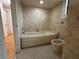 Clean bathroom with a bathtub and bidet at 461 S Florida Ave, Tarpon Springs, FL 34689