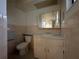 Small bathroom with a toilet and vanity at 461 S Florida Ave, Tarpon Springs, FL 34689