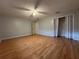 Bright bedroom featuring wood floors and a large closet at 461 S Florida Ave, Tarpon Springs, FL 34689