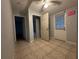 Clean hallway with tile floors and access to other rooms at 461 S Florida Ave, Tarpon Springs, FL 34689