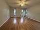 Bright living room with laminate wood floors and lots of natural light at 461 S Florida Ave, Tarpon Springs, FL 34689