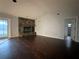 Living room with stone fireplace and sliding glass doors at 461 S Florida Ave, Tarpon Springs, FL 34689