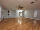 Spacious living area with wood floors and access to other rooms at 461 S Florida Ave, Tarpon Springs, FL 34689