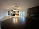 Living room features a stone fireplace and laminate wood floors at 461 S Florida Ave, Tarpon Springs, FL 34689