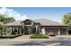 Luxury home with a three-car garage and manicured landscaping at 4644 Higel Ave, Sarasota, FL 34242