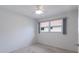 Bright bedroom with neutral walls and carpet, featuring a large window at 468 Leger Dr, Nokomis, FL 34275