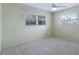 Light and airy bedroom with neutral walls, carpet and windows at 468 Leger Dr, Nokomis, FL 34275