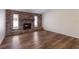 Living room with brick fireplace and wood floors at 468 Leger Dr, Nokomis, FL 34275