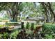 Community entrance with landscaping and a sign at 4720 Oak Forest W Dr # 57, Sarasota, FL 34231