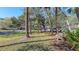 Community area with lush landscaping and benches at 4720 Oak Forest W Dr # 57, Sarasota, FL 34231