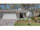 Front exterior of the home with a paved driveway at 4720 Oak Forest W Dr # 57, Sarasota, FL 34231