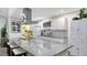 Modern kitchen with large island and granite countertops at 4720 Oak Forest W Dr # 57, Sarasota, FL 34231