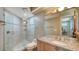 Bathroom with granite vanity and walk-in shower at 50 Lighthouse Point Dr, Longboat Key, FL 34228