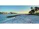 Private beach with white sand and calm waters at 50 Lighthouse Point Dr, Longboat Key, FL 34228