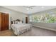 Bedroom with wood floors and large windows at 50 Lighthouse Point Dr, Longboat Key, FL 34228