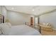 Spacious bedroom with wood floors and chaise lounge at 50 Lighthouse Point Dr, Longboat Key, FL 34228