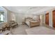 Comfortable guest bedroom with ensuite bathroom at 50 Lighthouse Point Dr, Longboat Key, FL 34228