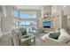 Spacious living room with high ceilings and water views at 50 Lighthouse Point Dr, Longboat Key, FL 34228