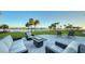 Spacious patio with fire pit and comfortable seating at 50 Lighthouse Point Dr, Longboat Key, FL 34228