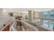 Open landing overlooking living area and pool at 50 Lighthouse Point Dr, Longboat Key, FL 34228