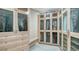 Large walk-in closet with built-in shelving and drawers at 50 Lighthouse Point Dr, Longboat Key, FL 34228