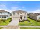 Two-story house with attached garage and landscaped front yard at 5316 Rocky Coast Place, Palmetto, FL 34221