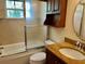 Bathroom features a tub shower combo, granite vanity, and updated fixtures at 5405 Fair Oaks St # 5405, Bradenton, FL 34203