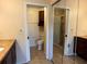 Bathroom with granite vanity, shower, and mirrored closet at 5405 Fair Oaks St # 5405, Bradenton, FL 34203