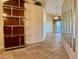 Bright and spacious entryway with tile flooring and built-in shelving at 5405 Fair Oaks St # 5405, Bradenton, FL 34203