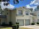 Front view of two-story condo with double garage at 5405 Fair Oaks St # 5405, Bradenton, FL 34203