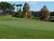 Putting green with flag and background view of condos at 5405 Fair Oaks St # 5405, Bradenton, FL 34203